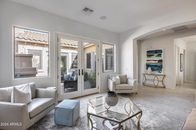 2340 W Horsetail Trl, Phoenix, AZ 85085 - living room with arched walkways and french doors