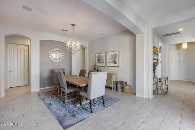 dining space featuring a notable chandelier