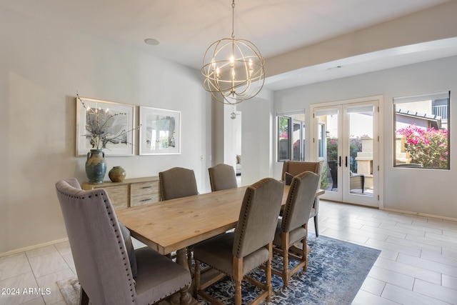 2340 W Horsetail Trl, Phoenix, AZ 85085 - dining space with french doors, a chandelier, light tile patterned floors, and baseboards