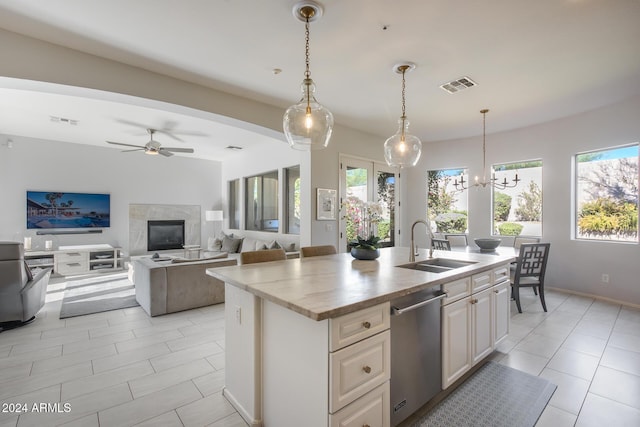 2340 W Horsetail Trl, Phoenix, AZ 85085 - kitchen with stainless steel dishwasher, plenty of natural light, a sink, and an island with sink