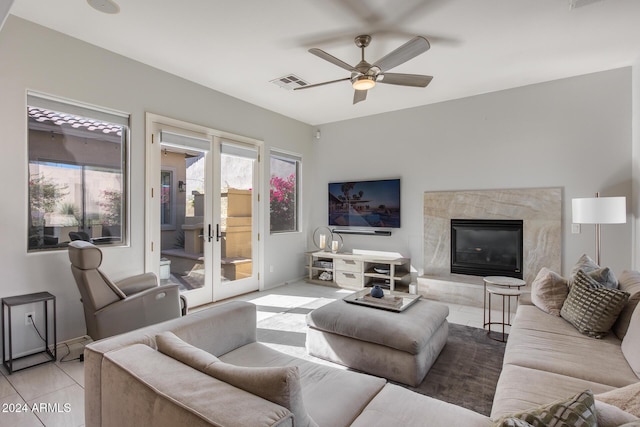 2340 W Horsetail Trl, Phoenix, AZ 85085 - living room with a ceiling fan, light tile patterned floors, baseboards, and a fireplace