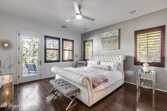 bedroom with access to outside, multiple windows, dark wood-type flooring, and ceiling fan