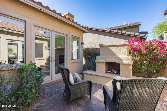 2340 W Horsetail Trl, Phoenix, AZ 85085 - view of patio / terrace featuring exterior fireplace