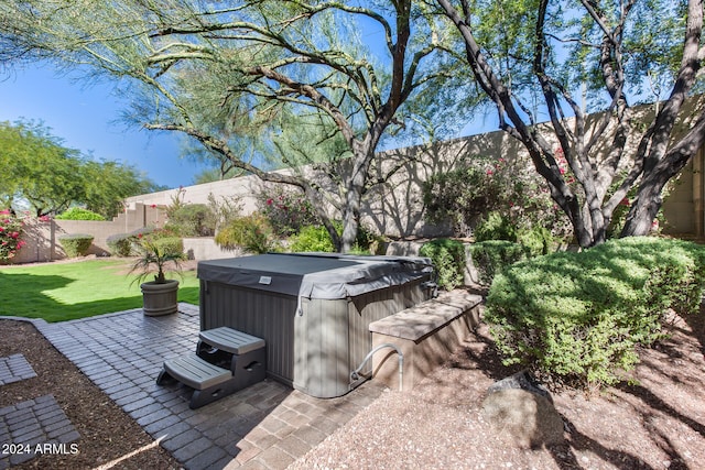 view of patio / terrace featuring a hot tub