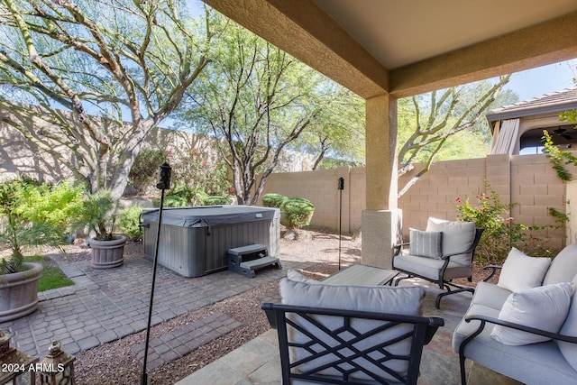 2340 W Horsetail Trl, Phoenix, AZ 85085 - view of patio with a hot tub, outdoor lounge area, and a fenced backyard