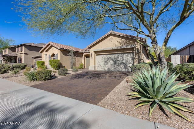 2340 W Horsetail Trl, Phoenix, AZ 85085 - view of front of property with an attached garage, stucco siding, driveway, and a tiled roof