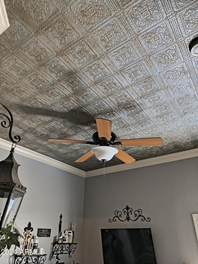 interior details with ceiling fan and ornamental molding