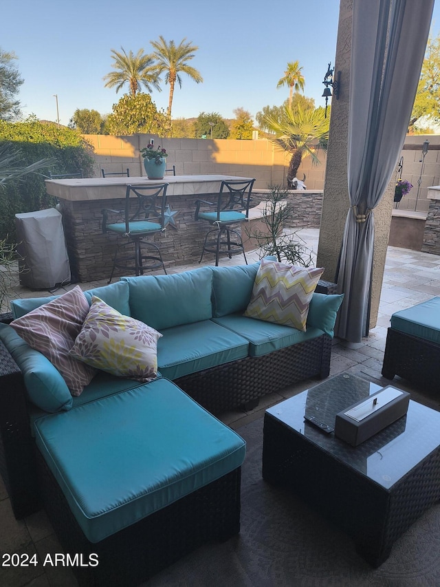 view of patio featuring an outdoor bar