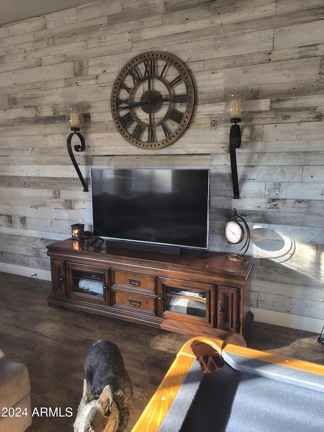 room details featuring wood walls and hardwood / wood-style floors