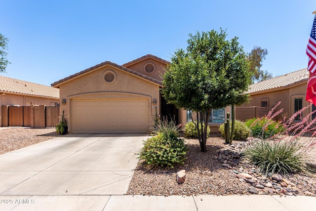 1325 E Linda Dr, Casa Grande, AZ 85122 - mediterranean / spanish home featuring an attached garage, concrete driveway, and stucco siding