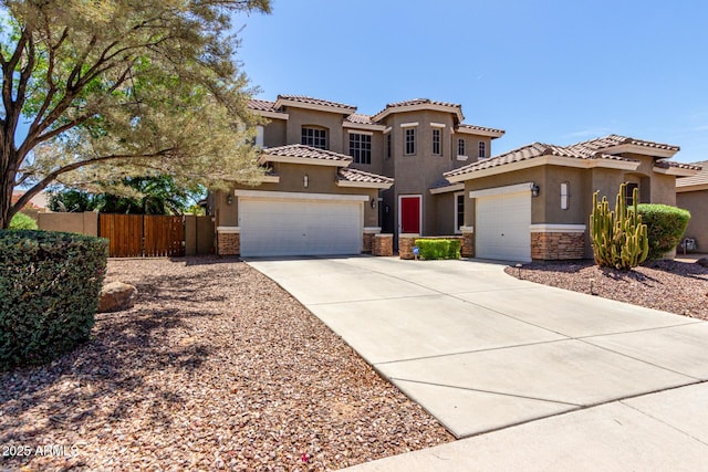 4123 S Wayne Pl, Chandler, AZ 85249 - mediterranean / spanish-style house with stone siding, stucco siding, fence, concrete driveway, and a tile roof