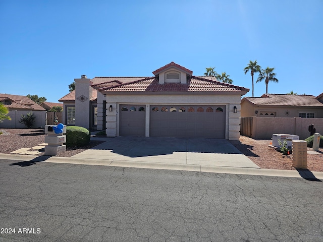 mediterranean / spanish-style home featuring a garage