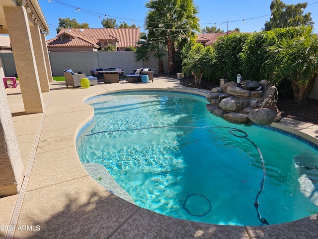 view of pool with outdoor lounge area and a patio area