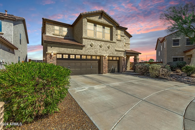 view of front of property with a garage