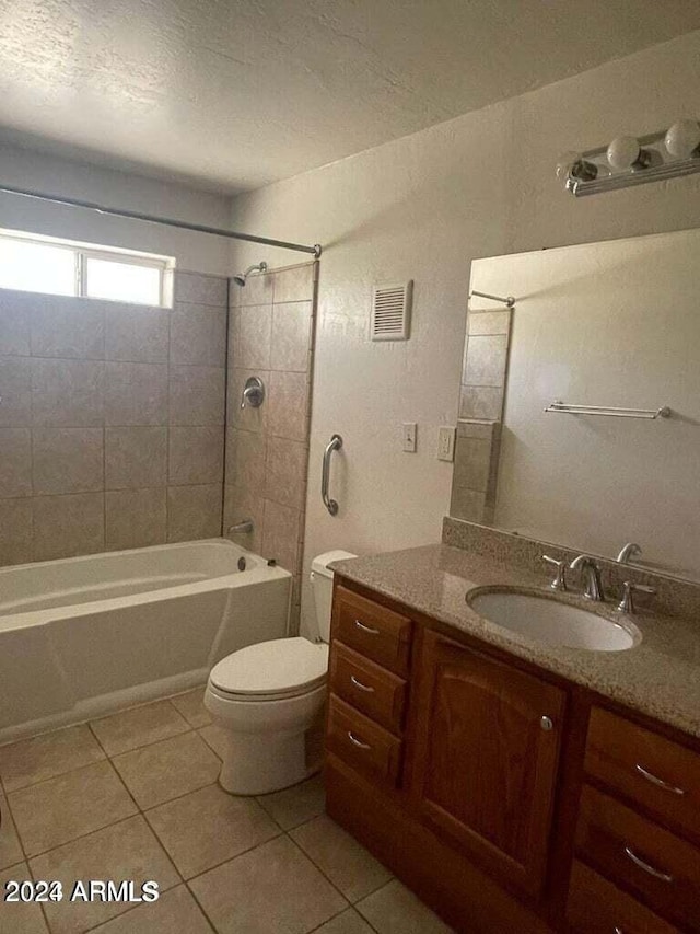 bathroom with toilet, vanity, visible vents, and tile patterned floors