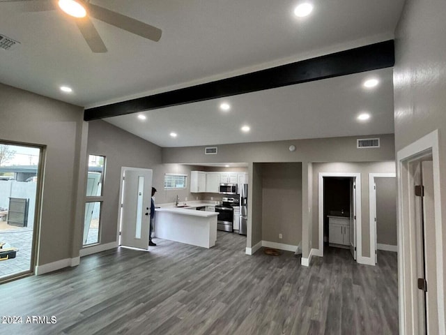 kitchen featuring stainless steel appliances, light countertops, visible vents, lofted ceiling with beams, and white cabinets