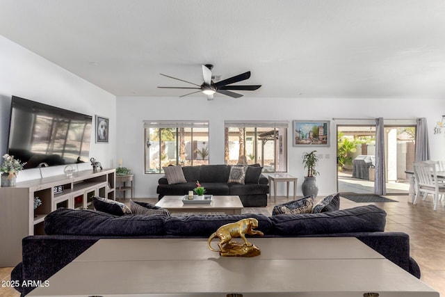 living room featuring tile patterned flooring and ceiling fan