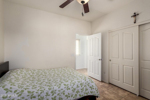 bedroom with a ceiling fan, a closet, and light tile patterned flooring