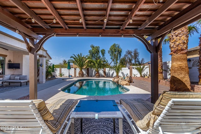 view of pool with an outdoor hangout area, a patio, a fenced backyard, and a fenced in pool