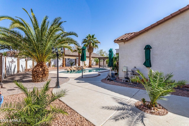 view of pool featuring a fenced in pool, a patio area, and a fenced backyard