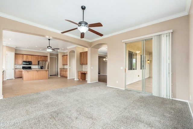 4253 N Yates Ave, Prescott Valley, AZ 86314 - unfurnished living room featuring a ceiling fan, arched walkways, ornamental molding, baseboards, and light carpet