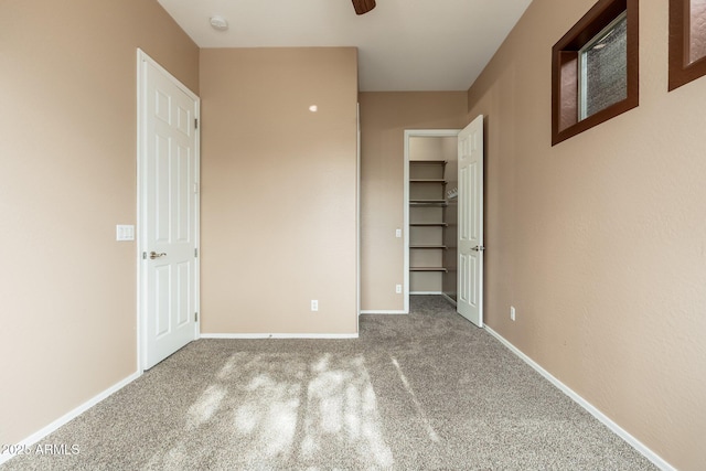 4253 N Yates Ave, Prescott Valley, AZ 86314 - unfurnished bedroom with carpet flooring, a spacious closet, and baseboards