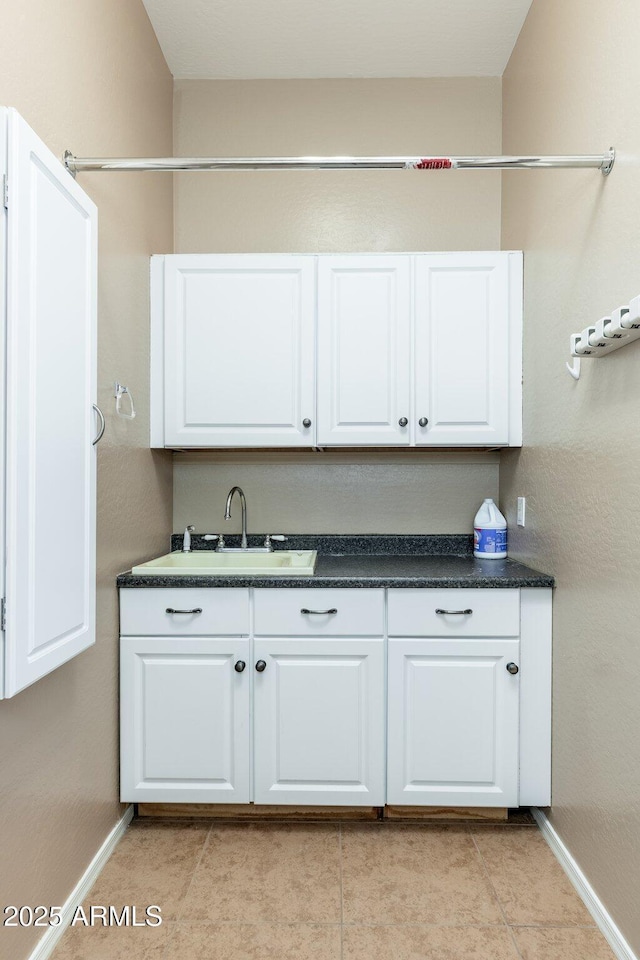 4253 N Yates Ave, Prescott Valley, AZ 86314 - kitchen featuring baseboards, a sink, and white cabinetry
