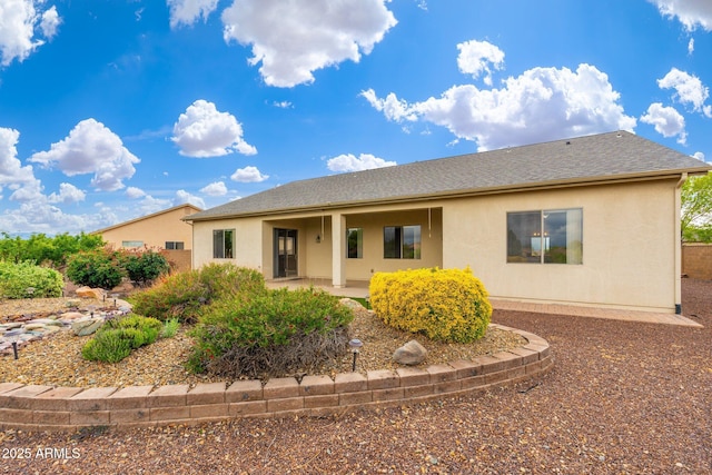 4253 N Yates Ave, Prescott Valley, AZ 86314 - view of front of house featuring stucco siding, a patio, and roof with shingles