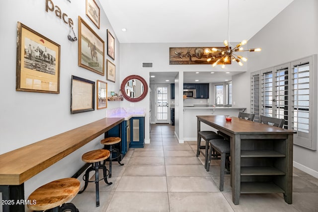 dining space with visible vents, a notable chandelier, recessed lighting, light tile patterned floors, and baseboards