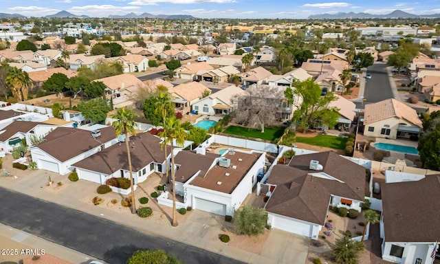 drone / aerial view with a residential view and a mountain view