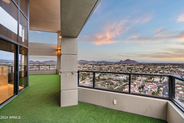 balcony at dusk with a mountain view