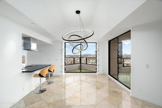 unfurnished dining area with an inviting chandelier