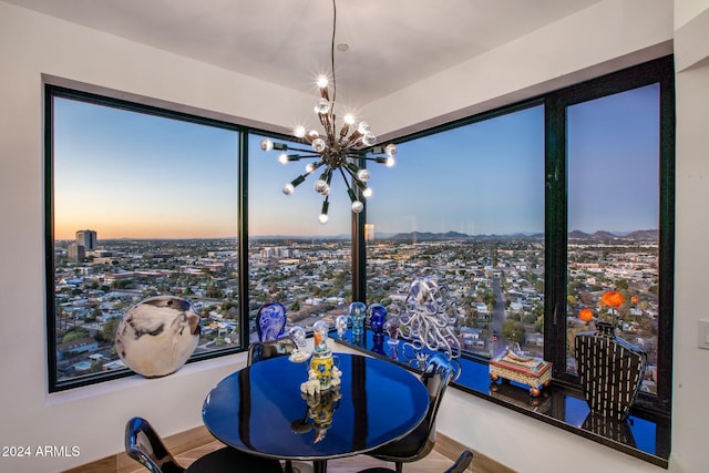 dining space featuring a notable chandelier and hardwood / wood-style flooring