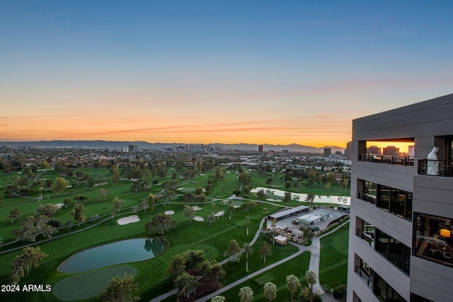 aerial view at dusk with a water view