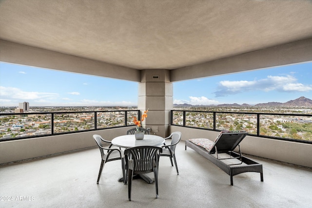 balcony featuring a mountain view