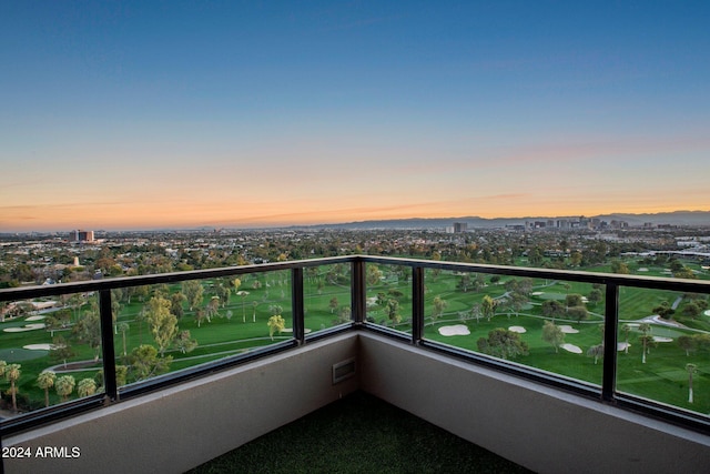 view of balcony at dusk