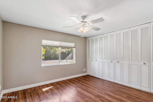 unfurnished bedroom featuring ceiling fan and hardwood / wood-style floors