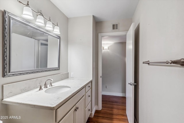 bathroom featuring vanity and wood-type flooring