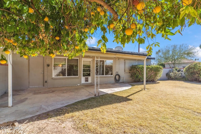 back of property with a patio area