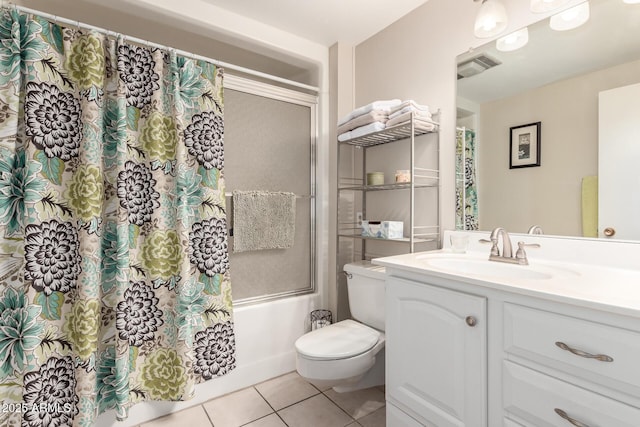 9826 W Emberwood Dr, Sun City, AZ 85351 - bathroom with tile patterned floors, visible vents, toilet, shower / bath combo, and vanity