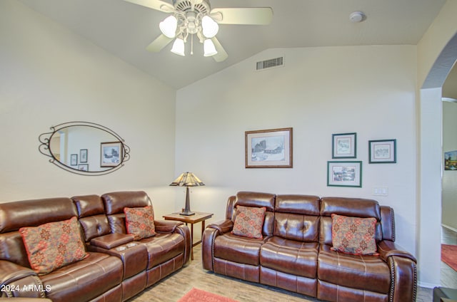 living room featuring ceiling fan, lofted ceiling, and hardwood / wood-style floors