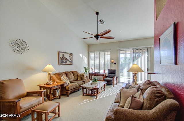 carpeted living room with high vaulted ceiling and ceiling fan