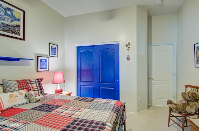 carpeted bedroom featuring a closet