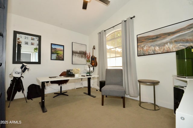 home office featuring lofted ceiling, a ceiling fan, and carpet floors