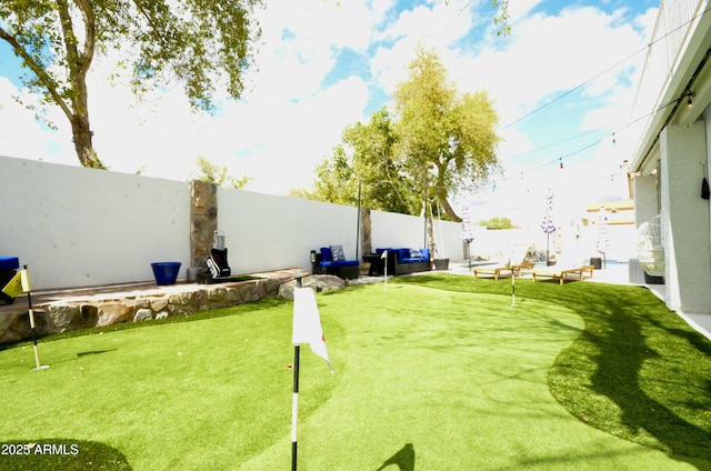 view of yard with a fenced backyard