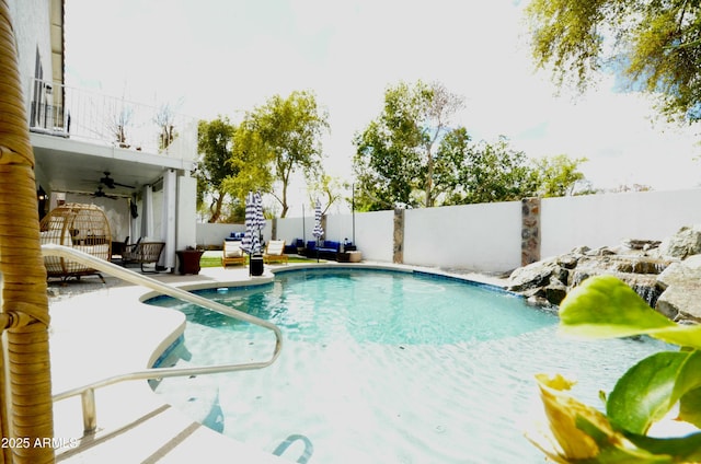 view of pool with a fenced backyard, a patio, and ceiling fan