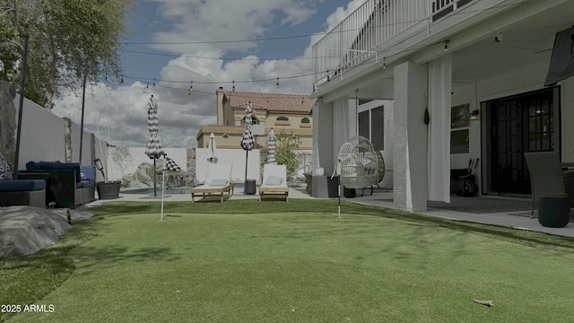 view of yard featuring a patio area and a fenced backyard