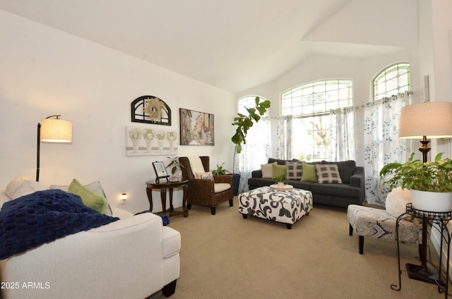 carpeted living area with lofted ceiling