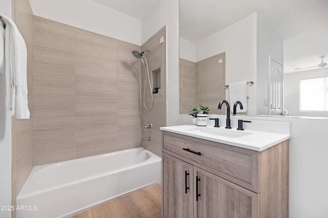 bathroom with shower / washtub combination, vanity, and wood finished floors