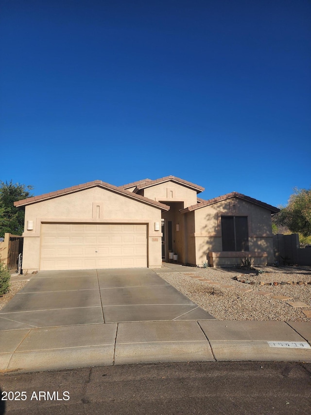 16404 S 18th Dr, Phoenix, AZ 85045 - single story home with concrete driveway, an attached garage, and stucco siding